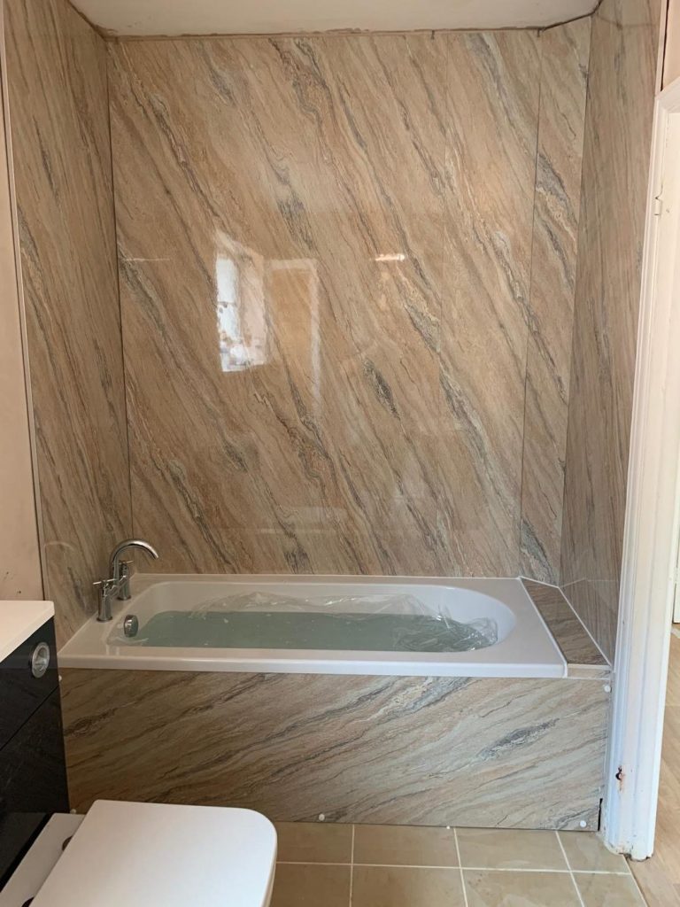 Bath installed with marble-effect wall panels